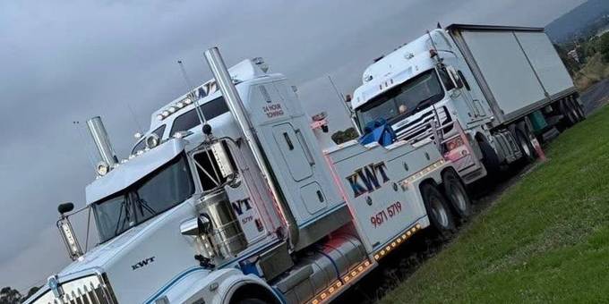 Car secured on a KWT tilt tray — car towing Sydney