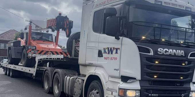 KWT heavy wrecker towing a truck — heavy vehicle towing NSW