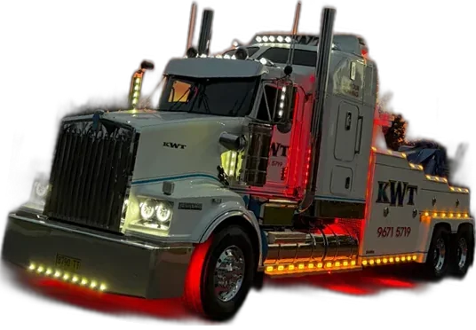 KWT Kenworth heavy tow truck driving to a breakdown at night