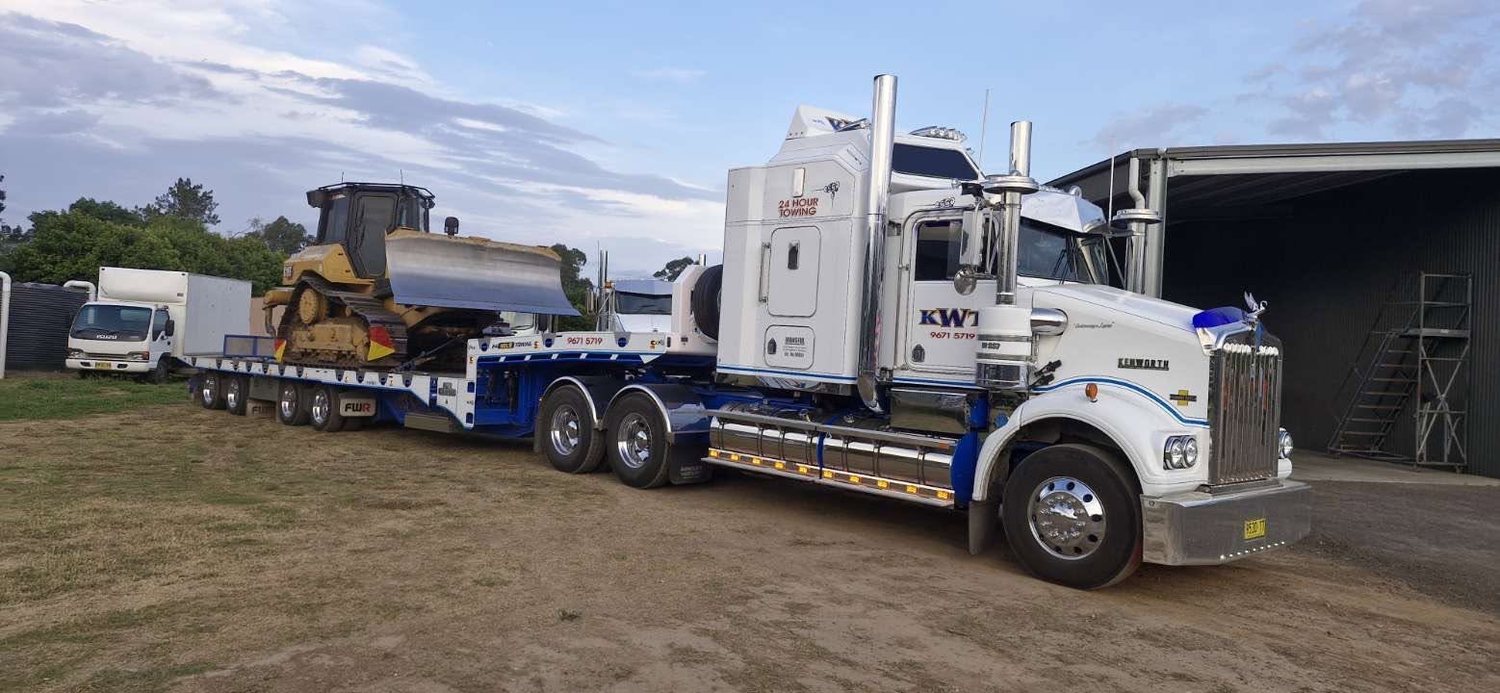 Heavy machinery transport on low loader, NSW Wide