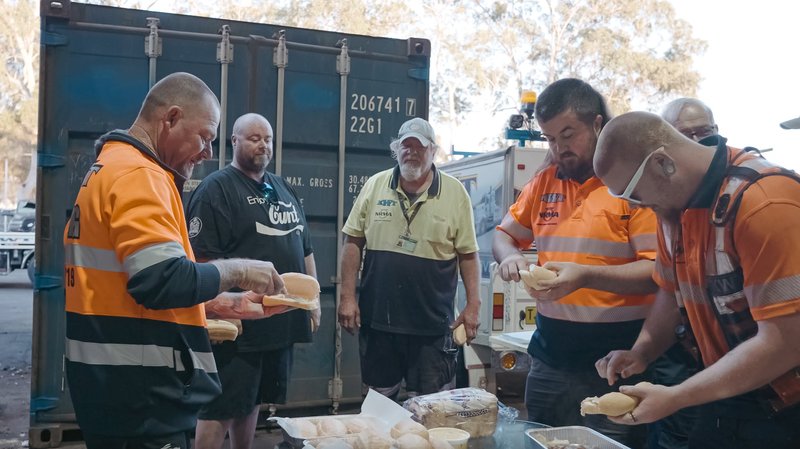 The KWT crew serving food at a community event