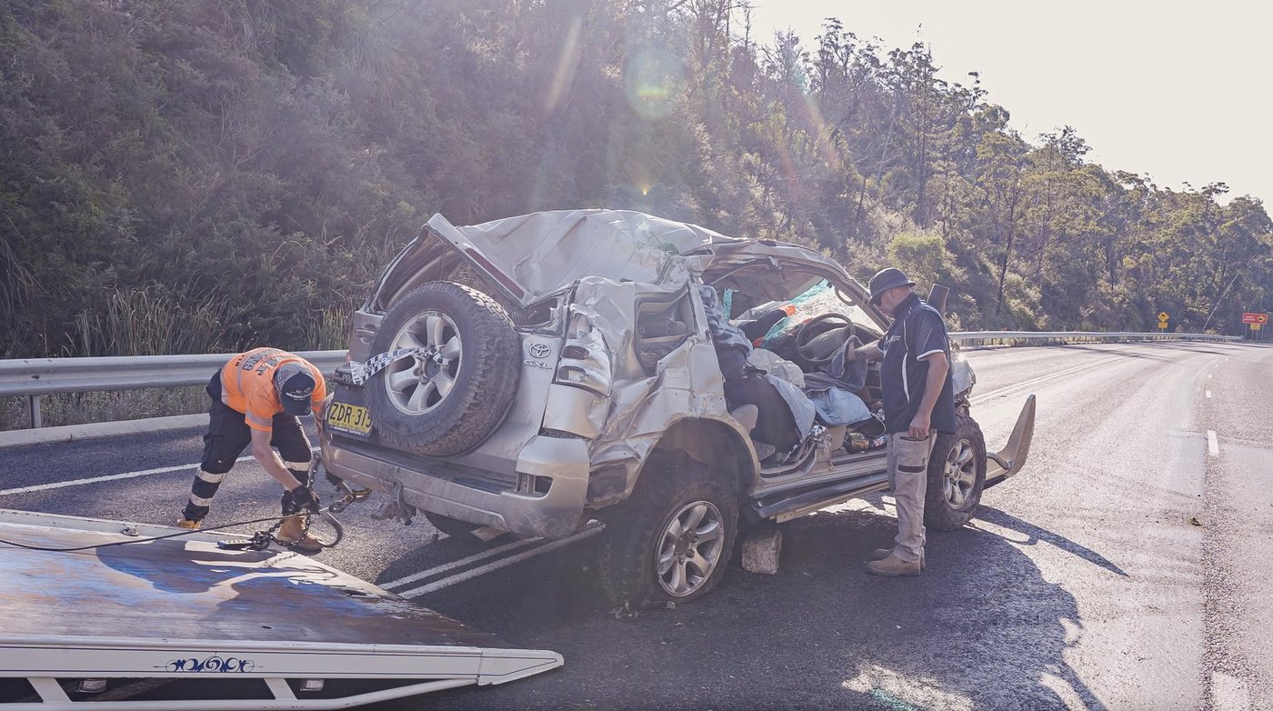 Rollover accident recovery — KWT crew securing a vehicle roadside