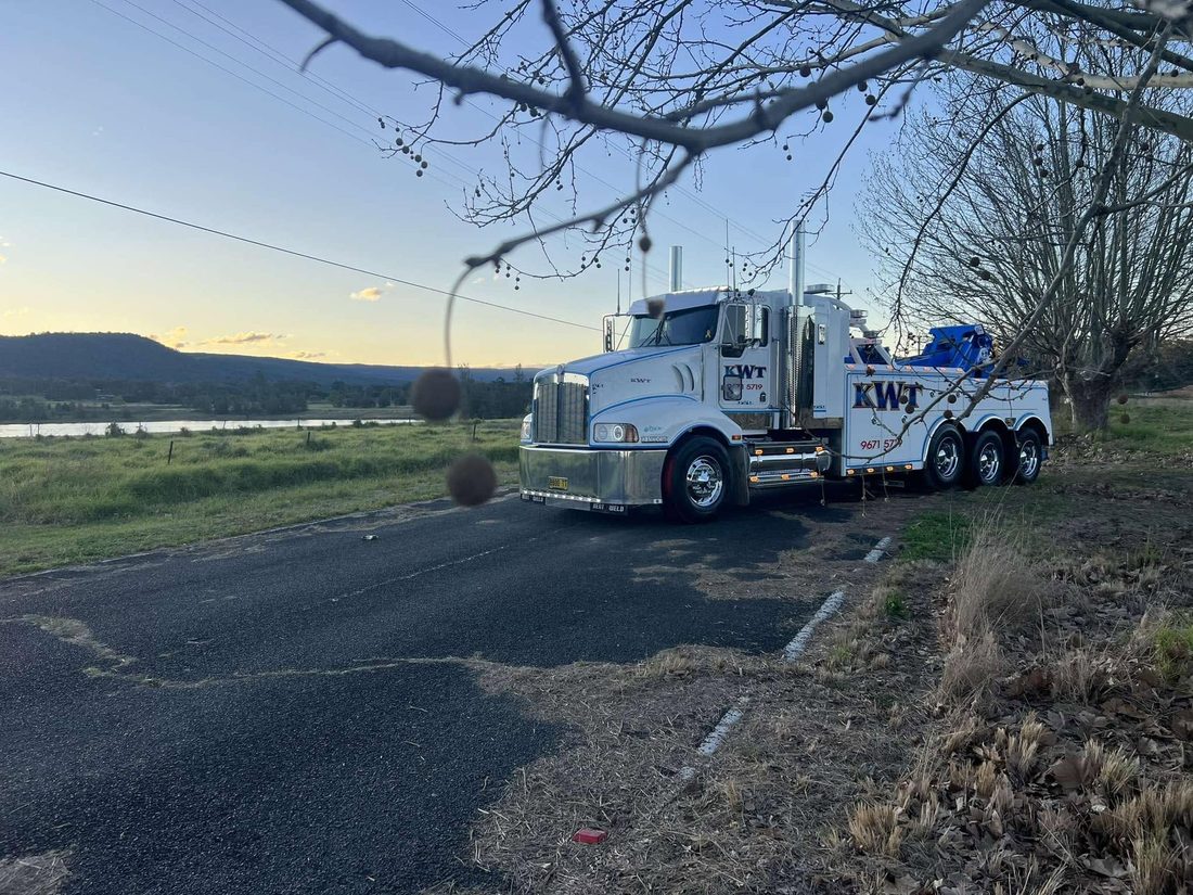 KWT truck out on the road at dusk