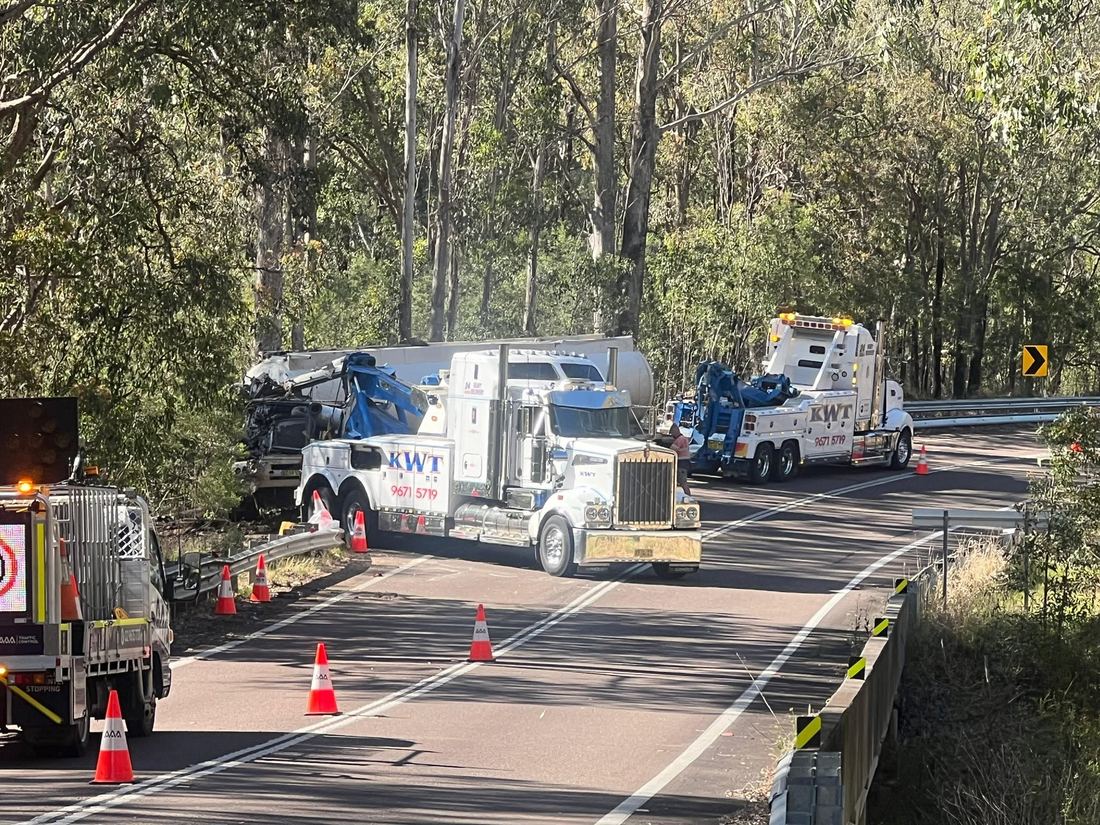 KWT convoy transporting multiple units with traffic control in place