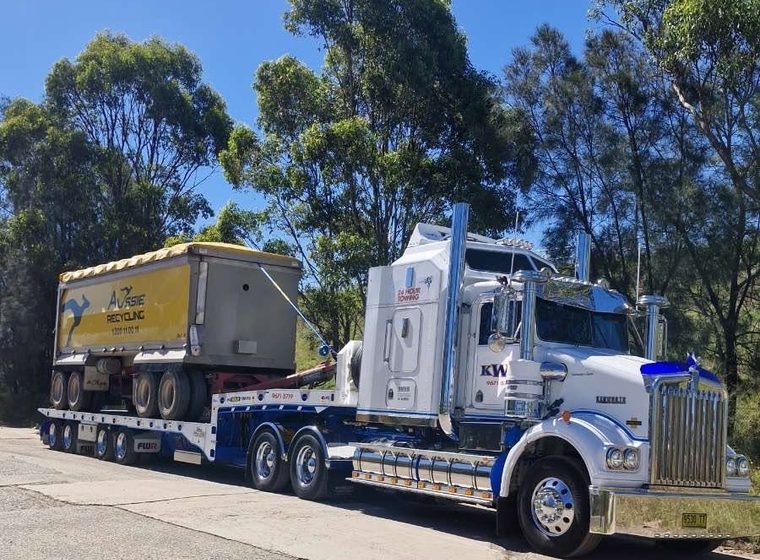 KWT prime mover with a tipper body loaded on a float