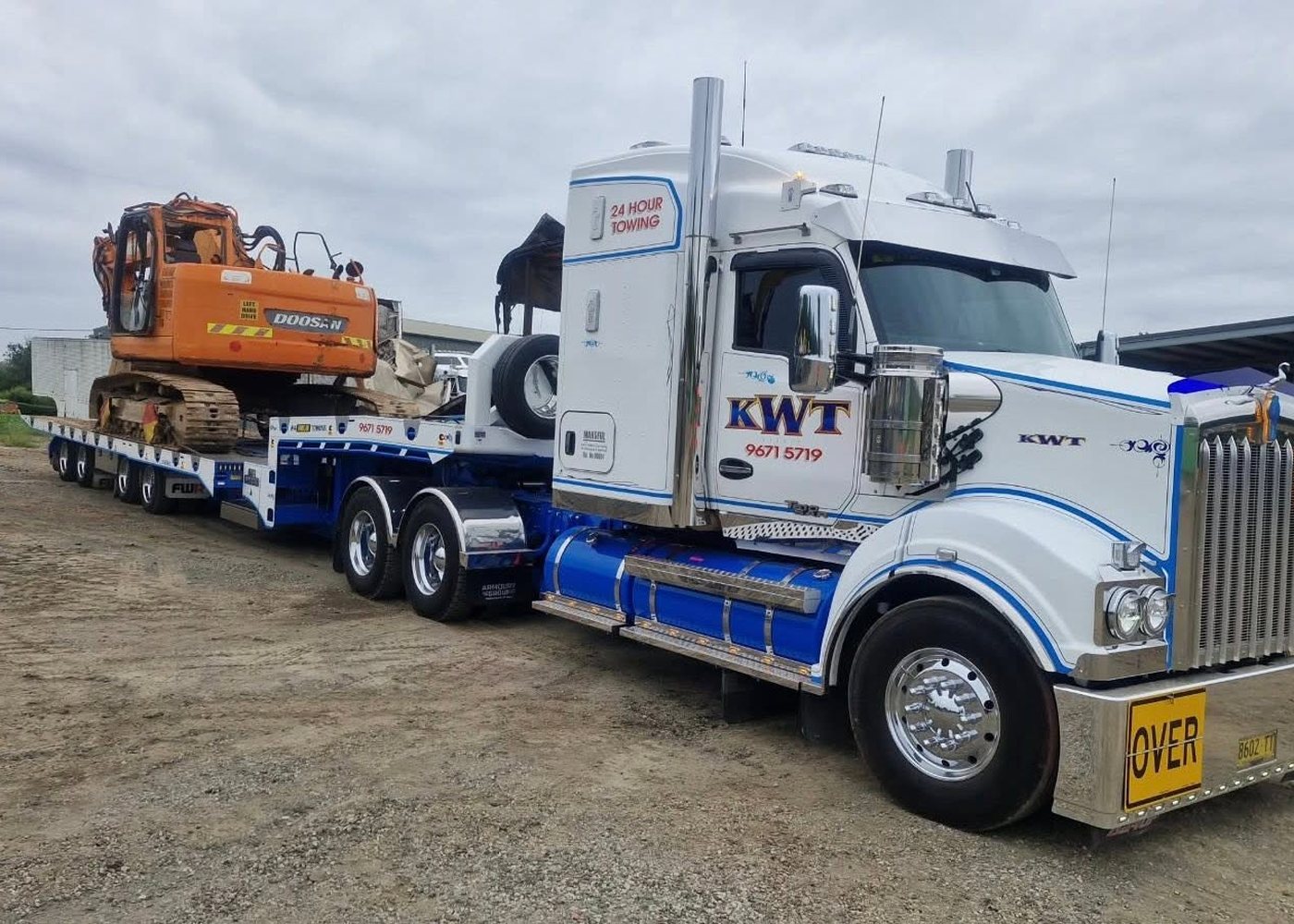 Excavator loaded on a KWT low-loader for machinery transport