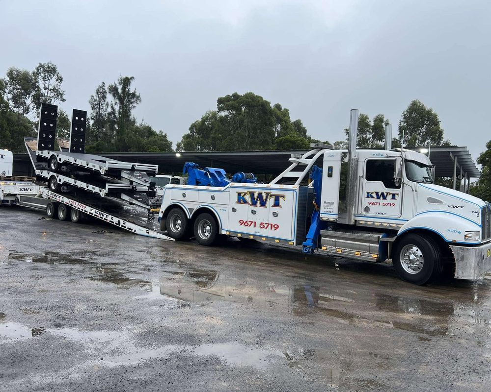 KWT truck towing a light commercial van