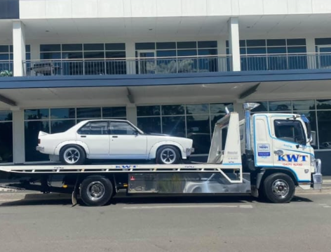 Car secured on a KWT tilt tray — car towing Sydney
