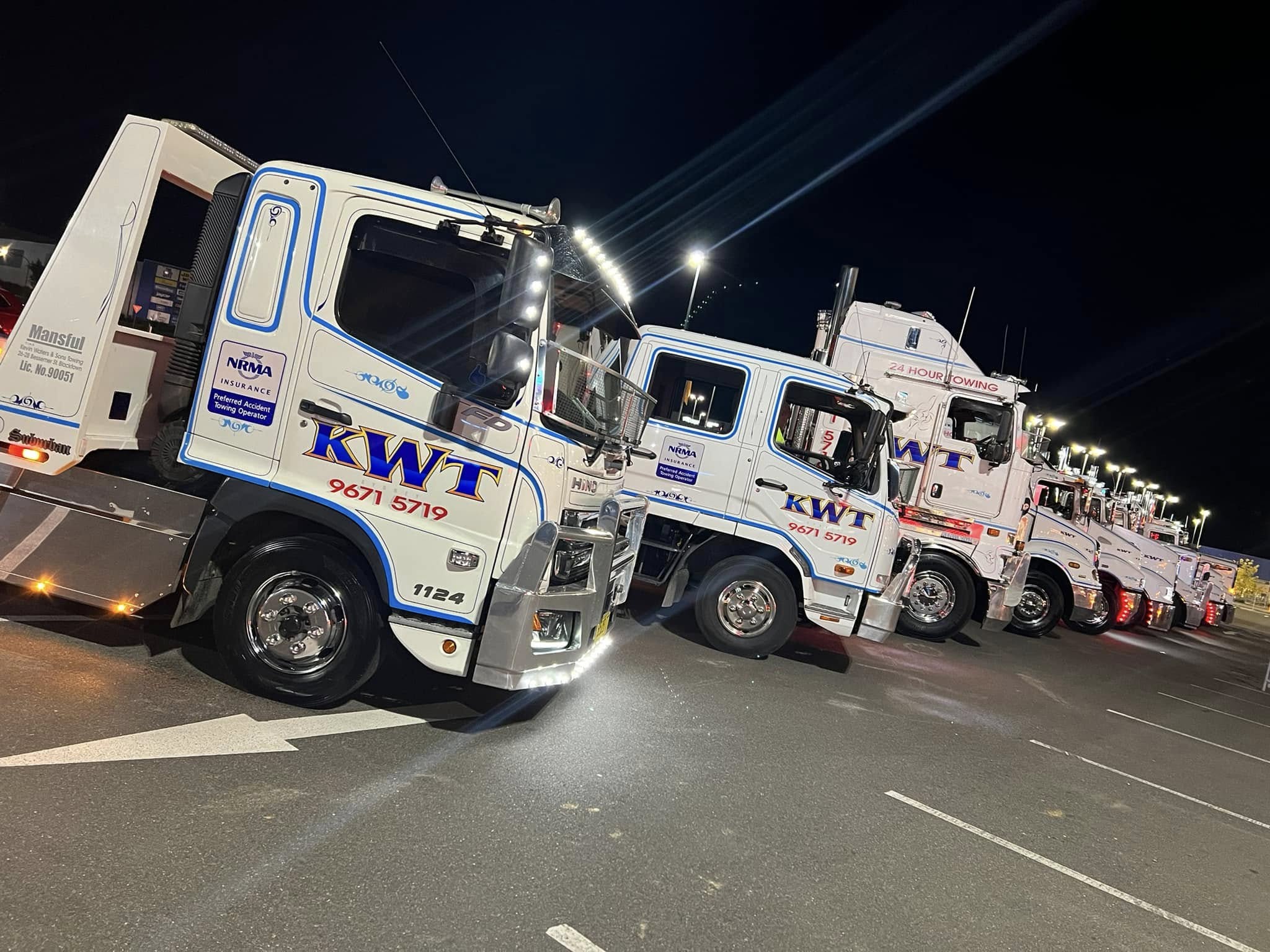 KWT Kenworth heavy tow truck with blue recovery boom, part of the KWT fleet